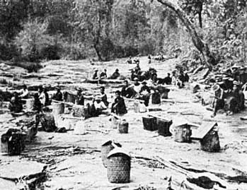 Porters of the A.P.E. expedition resting on the way to the base camp north of Chiengmai